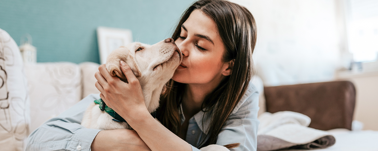 Animal Hospital in Wethersfield: Woman Kissing Puppy